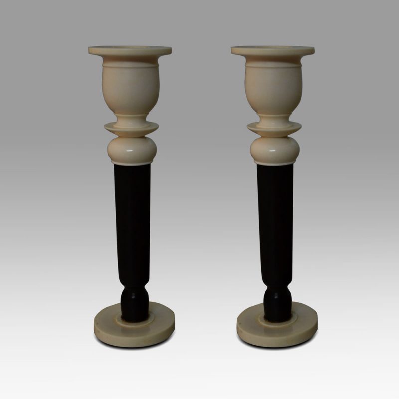 A pair of ivory candlesticks