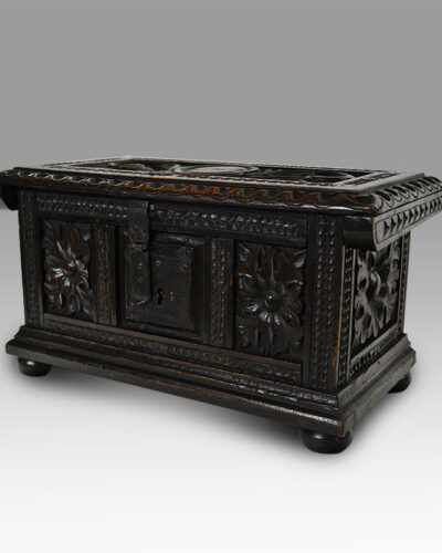 A Spanish Baroque carved walnut money chest