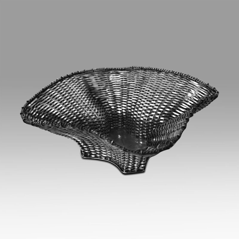 An antique silver knitted fruit bowl